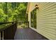 The deck overlooks the backyard and has wooden railings at 106 Redbud, Pittsboro, NC 27312