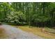 Backyard gardens adjacent to gravel driveway at 106 Redbud, Pittsboro, NC 27312