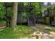 Pergola with seating area, steps, and landscaping at 106 Redbud, Pittsboro, NC 27312