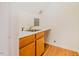 Practical utility sink with wood cabinets and laminate countertops at 106 Redbud, Pittsboro, NC 27312