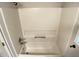 A bathtub showcases the white clean tiling at 109 Elmview Dr, Cary, NC 27519