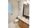 Bathroom featuring wood cabinets, modern fixtures and a sink with vanity at 109 Elmview Dr, Cary, NC 27519