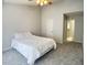 Spacious bedroom with high ceilings, carpeted floors, a ceiling fan and ensuite bathroom access at 109 Elmview Dr, Cary, NC 27519