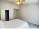 Comfortable bedroom featuring carpeted floors, high ceilings, and a doorway to an en-suite bathroom at 109 Elmview Dr, Cary, NC 27519