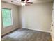 Spacious bedroom featuring neutral walls, carpet and a window at 109 Elmview Dr, Cary, NC 27519