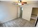 Neutral bedroom showcasing carpet and an entry to the upper level of the home at 109 Elmview Dr, Cary, NC 27519