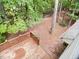 Wooden deck overlooking a wooded backyard, perfect for relaxation and outdoor enjoyment at 109 Elmview Dr, Cary, NC 27519
