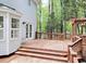 Spacious wooden deck with steps down to the yard and access to the home's interior at 109 Elmview Dr, Cary, NC 27519