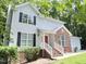 Beautiful two-story home with vinyl siding, complemented by a lush green lawn and an attached two-car garage at 109 Elmview Dr, Cary, NC 27519