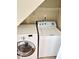 Bright laundry area featuring a white Whirlpool washing machine and dryer ready for use at 109 Elmview Dr, Cary, NC 27519