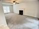 Spacious living room with a ceiling fan and natural light at 109 Elmview Dr, Cary, NC 27519