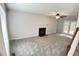 Bright living room featuring a fireplace and neutral color palette at 109 Elmview Dr, Cary, NC 27519