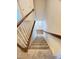 Carpeted staircase leading down to the home's main level and front door at 109 Elmview Dr, Cary, NC 27519