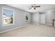 Large bedroom with two windows and a ceiling fan at 109 Faldo Cv, Raleigh, NC 27603