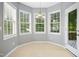 Bright breakfast nook featuring tile floors, multiple windows and an exterior door at 109 Faldo Cv, Raleigh, NC 27603