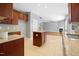 Open kitchen view with granite countertops, central island, and seamless access to the cozy living room at 109 Faldo Cv, Raleigh, NC 27603
