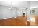 Spacious living room featuring hardwood floors, a fireplace, and ample natural light at 109 Faldo Cv, Raleigh, NC 27603