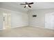 Large bedroom with an ensuite bathroom, ceiling fan, and a TV mount on the wall at 109 Faldo Cv, Raleigh, NC 27603