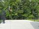 Neighborhood basketball court with well-maintained concrete and black metal fence at 1165 Sun Spgs Rd, Wake Forest, NC 27587