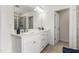 Well-lit bathroom featuring a double sink vanity with white countertops and cabinet storage at 1165 Sun Spgs Rd, Wake Forest, NC 27587