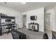 A comfortably decorated bedroom is equipped with desk, shelving, and a wall mounted television at 1165 Sun Spgs Rd, Wake Forest, NC 27587