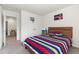 Colorful bedroom featuring a bed, a basketball hoop, and a storage cabinet at 1165 Sun Spgs Rd, Wake Forest, NC 27587