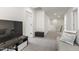 Upstairs hallway with view of the Gathering room, featuring carpet, TV, and modern finishes at 1165 Sun Spgs Rd, Wake Forest, NC 27587