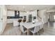 Bright kitchen featuring a marble dining table, stainless steel appliances, and modern finishes at 1165 Sun Spgs Rd, Wake Forest, NC 27587
