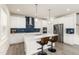 Modern kitchen featuring white cabinets, stainless steel appliances, and a stylish backsplash at 1165 Sun Spgs Rd, Wake Forest, NC 27587