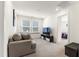 Comfortable living room with couch, tv, and carpet floors with a view into another bedroom space at 1165 Sun Spgs Rd, Wake Forest, NC 27587