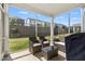 Covered patio with wicker furniture set and a BBQ, overlooking the backyard at 1165 Sun Spgs Rd, Wake Forest, NC 27587