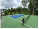 Well-maintained fenced pickleball court, perfect for neighborhood recreation and sports at 1165 Sun Spgs Rd, Wake Forest, NC 27587