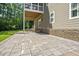Spacious stone patio outside this home featuring stone veneer and neutral exterior at 117 Synandra Ln, Holly Springs, NC 27540