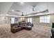 Finished basement offers a comfortable seating area, projector screen, and space for entertainment at 117 Synandra Ln, Holly Springs, NC 27540