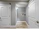 The laundry room shows hookups and access to the other rooms in the basement at 117 Synandra Ln, Holly Springs, NC 27540