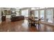 Living area with hardwood floors, plenty of natural light, and a dining area at 117 Synandra Ln, Holly Springs, NC 27540