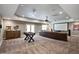 Spacious entertainment room with movie projector and tiered seating at 117 Synandra Ln, Holly Springs, NC 27540
