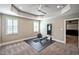 Spacious workout room with windows, fan, rubber mat, and adjustable workout bench at 117 Synandra Ln, Holly Springs, NC 27540