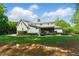 Expansive backyard featuring a patio with a fire pit and outdoor seating, perfect for entertaining guests at 125 Lord Ashley Rd, Raleigh, NC 27610