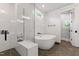 Spacious bathroom with glass enclosed shower and large tub at 125 Lord Ashley Rd, Raleigh, NC 27610