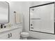 Bright bathroom with white tile shower, modern vanity, and sleek black fixtures at 125 Lord Ashley Rd, Raleigh, NC 27610