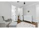 Bright Bedroom with crib, chair, walk in closet, and bathroom access at 125 Lord Ashley Rd, Raleigh, NC 27610