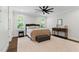 Bright bedroom with lots of natural light and a ceiling fan at 125 Lord Ashley Rd, Raleigh, NC 27610