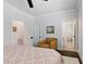 Cozy bedroom features a comfortable chair and multiple entry points to the attached rooms at 125 Lord Ashley Rd, Raleigh, NC 27610