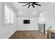 Cozy bonus room with hardwood floors, natural light, and modern ceiling fan at 125 Lord Ashley Rd, Raleigh, NC 27610