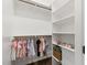 Organized walk-in closet with shelving and hanging clothes, ideal for storage at 125 Lord Ashley Rd, Raleigh, NC 27610