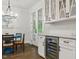 Bright dining area features a blue table, wood floors, and white cabinets at 125 Lord Ashley Rd, Raleigh, NC 27610