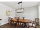 Dining room with wood table, chairs, and custom wainscoting at 125 Lord Ashley Rd, Raleigh, NC 27610