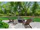 Patio area with comfortable outdoor seating around a fire pit for relaxing and entertaining at 125 Lord Ashley Rd, Raleigh, NC 27610