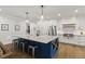 Modern open concept kitchen features a large island with stainless steel appliances at 125 Lord Ashley Rd, Raleigh, NC 27610